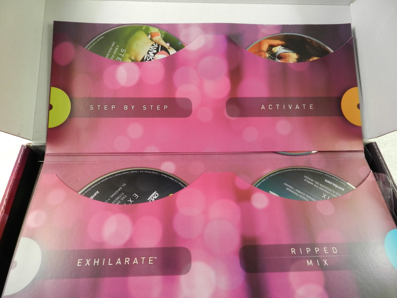 Zumba Fitness Exhilarate Body Shaping System 5 DVDs Weight Sticks Guide Like New