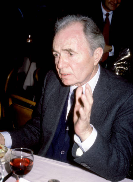 James Mason sits at a table at an unspecified event in New York Fe- Old Photo