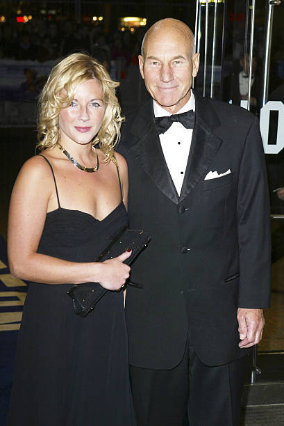 Patrick Stewart and an unidentified guest arrive at the Cinema an- 2004 Photo