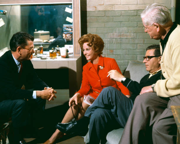 Susan Hayward talking to producer David Weisbart on the set of Va- Old Photo