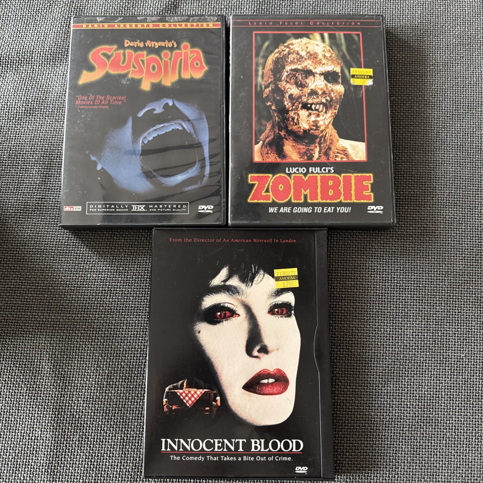 3 Cult DVD Lot: Lucio Fulci’s Zombie, Suspiria , And Innocent Blood (Pre Owned)